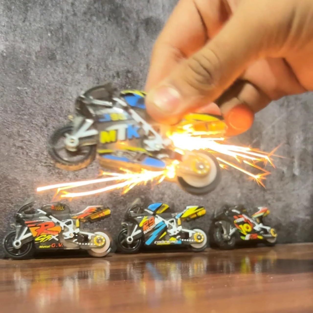 Sparkling Stunt Bike Keychain. Pull Back Friction Powered Mini Motorcycle with Spark Lighting Effect